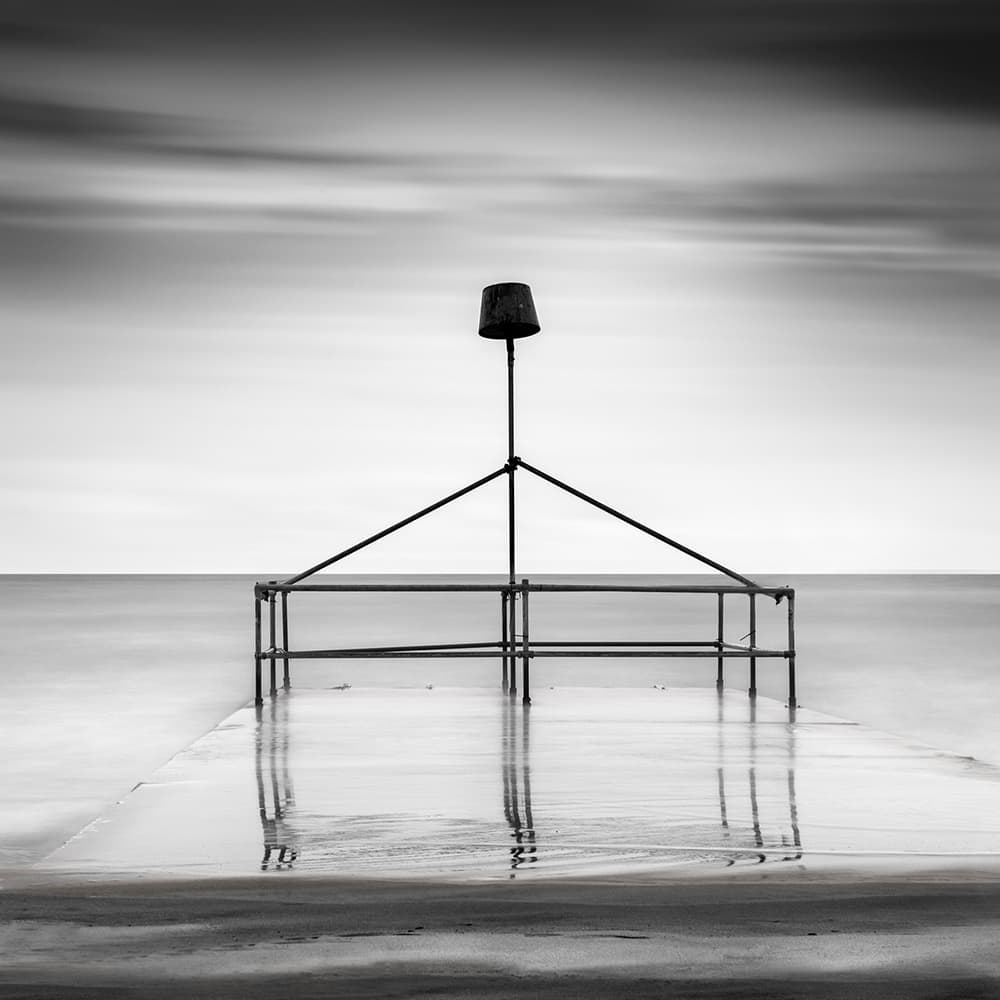 Calm Coastal Structure Reflection by George Digalakis — canvas wall art