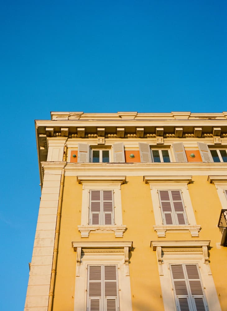 Sunny Yellow Building Facade by Bethany Young — canvas wall art