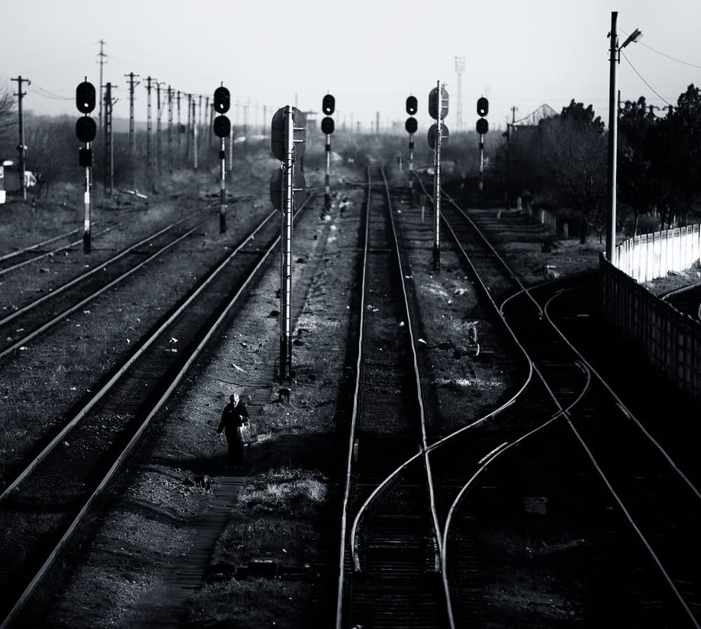 Solitary Figure on Tracks by Julien Oncete — canvas wall art