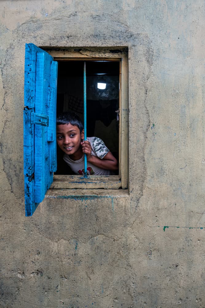 Curious Boy Blue Window by Ali Khataw — canvas wall art