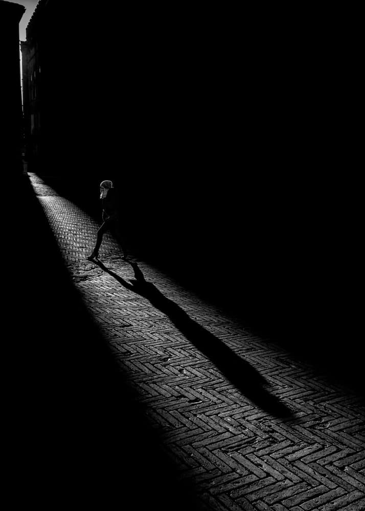 Lone Figure Long Shadow by Luca Domenichi — canvas wall art