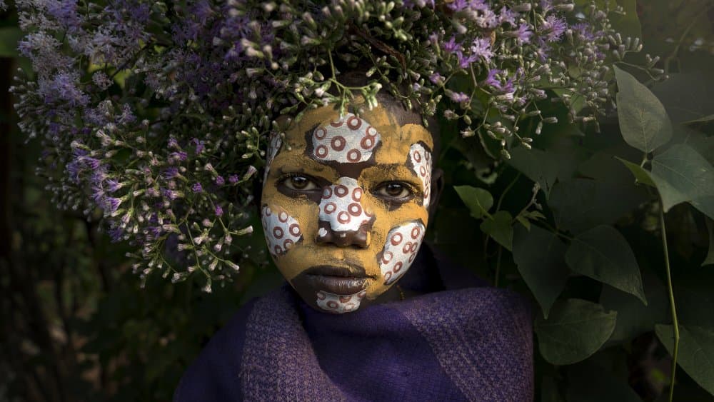 Floral Painted Face by Sarawut Intarob — canvas wall art