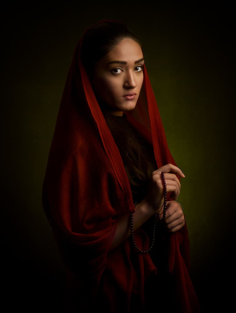 Pensive Woman Red Scarf by Mehdi Mokhtari — canvas wall art