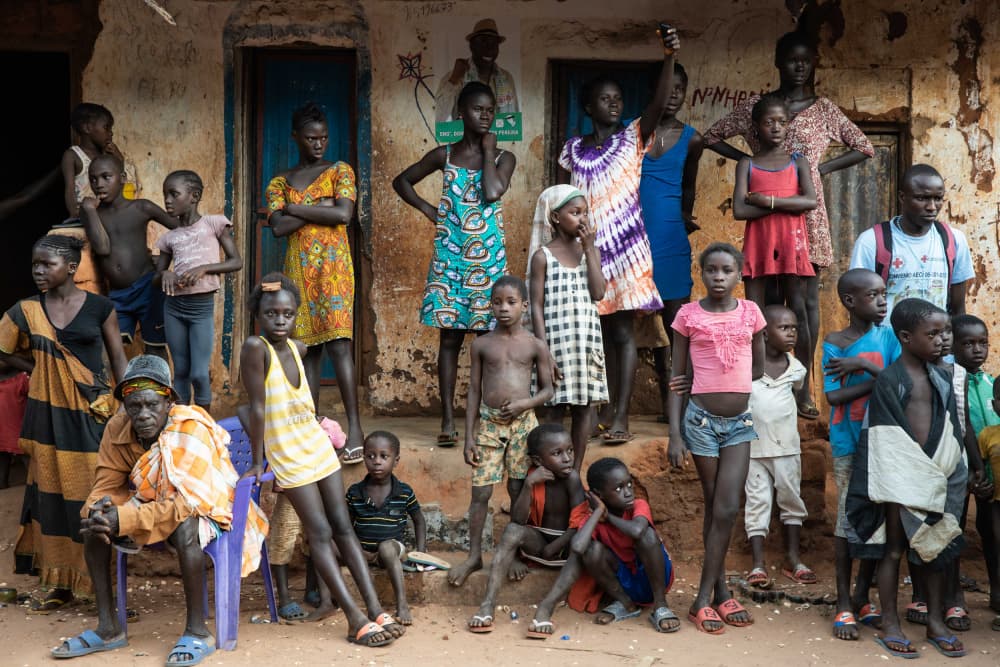 African Village Gathering by Ella Waldman — canvas wall art