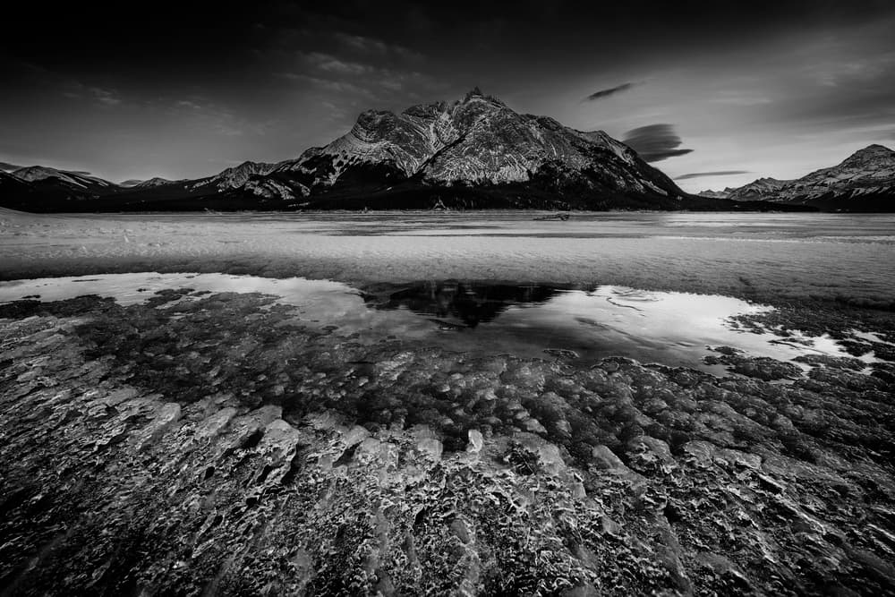 Frozen Mountain Lake Reflection by Lydia Jacobs — canvas wall art