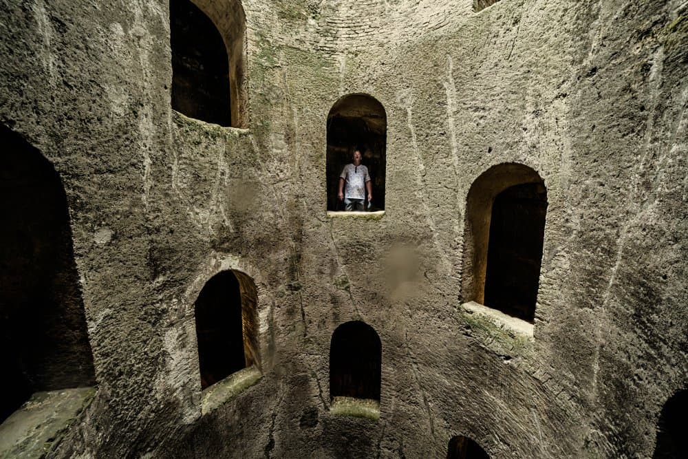 Man in Ancient Well by Donato Bellomo — canvas wall art