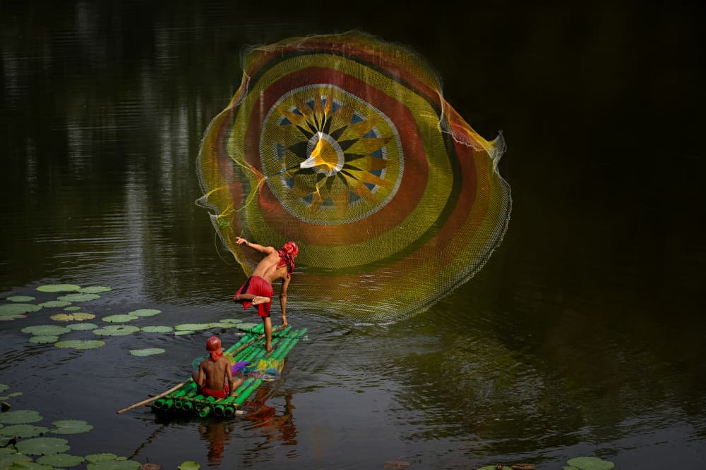 Fisherman's Colorful Cast by Ajar Setiadi — canvas wall art