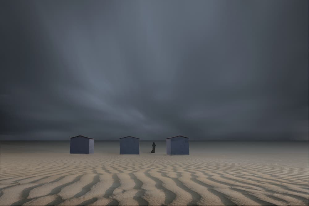 Lone Figure Desert Huts by Uschi Hermann — canvas wall art