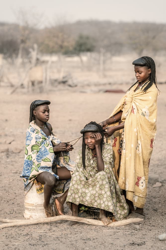 African Girls Braiding Hair by Trevor Cole — canvas wall art