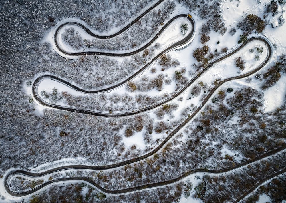 Winding Snowy Mountain Road by Juan I. Cuadrado — canvas wall art