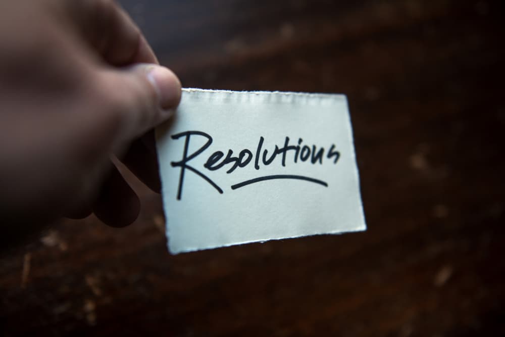 Hand Holding Resolutions by Tim Mossholder — canvas wall art
