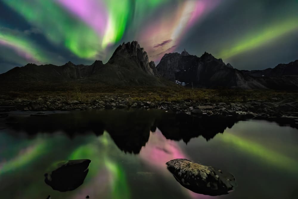 Vibrant Aurora Over Mountains by Jun Zuo — canvas wall art