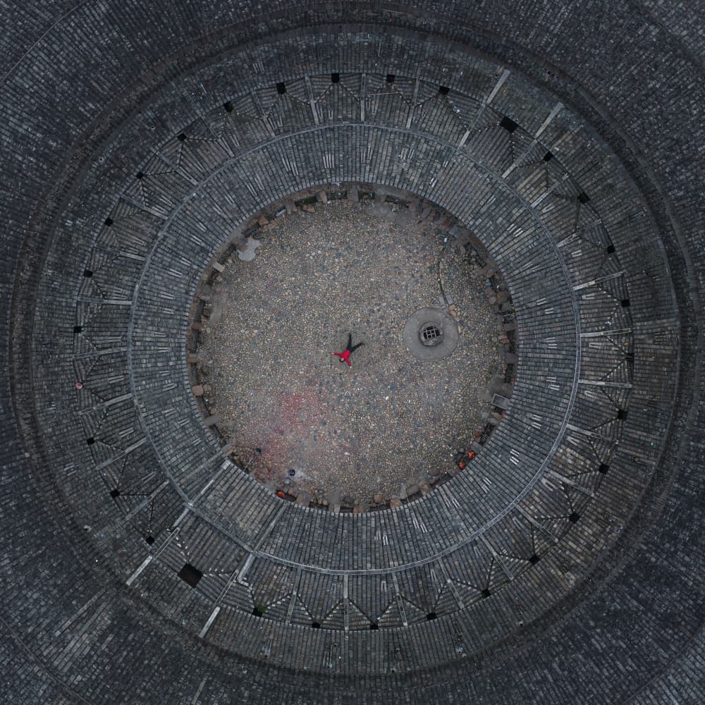 Lone Figure Round Building by Simoon — canvas wall art
