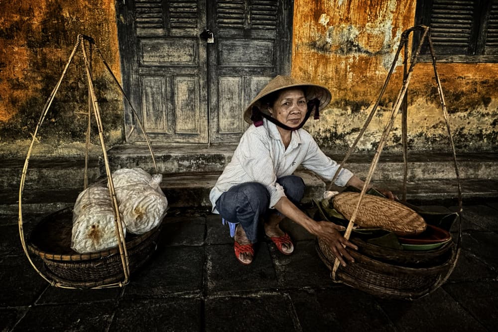 Hoi An Street Vendor by Pavol Stranak — canvas wall art
