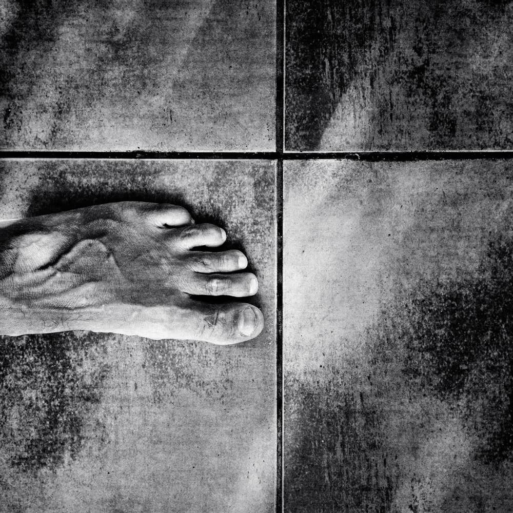 Bare Foot on Gritty Tile by txules — canvas wall art