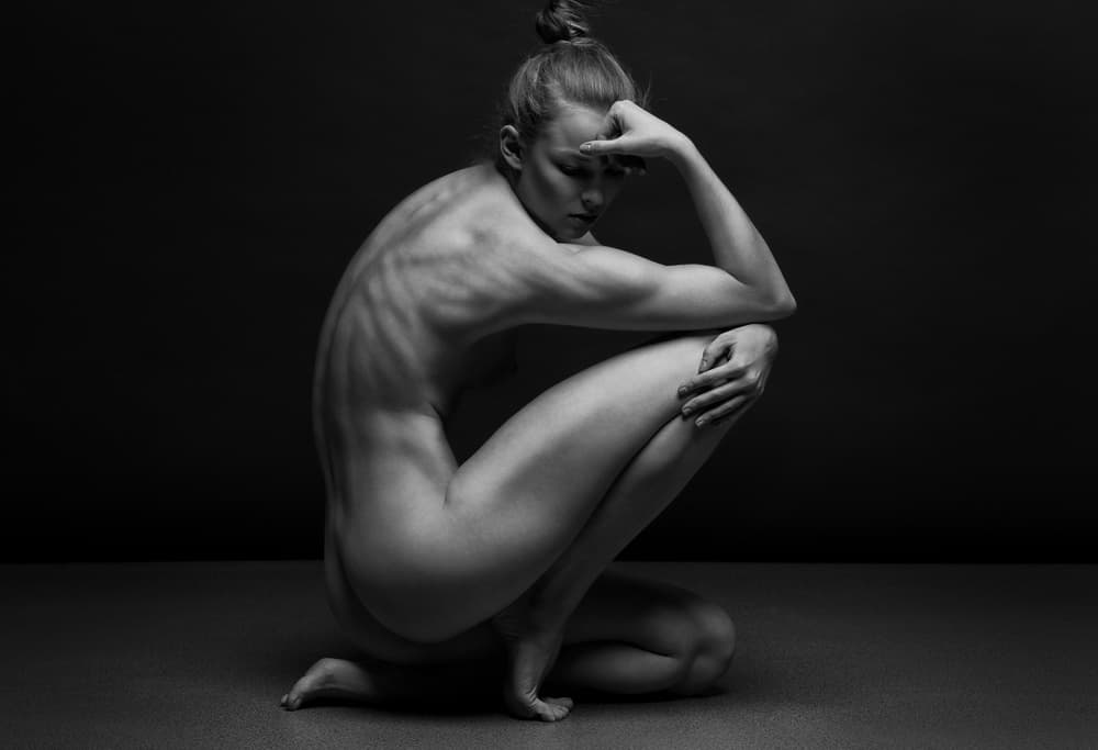 Dramatic Crouching Woman by Anton Belovodchenko — canvas wall art