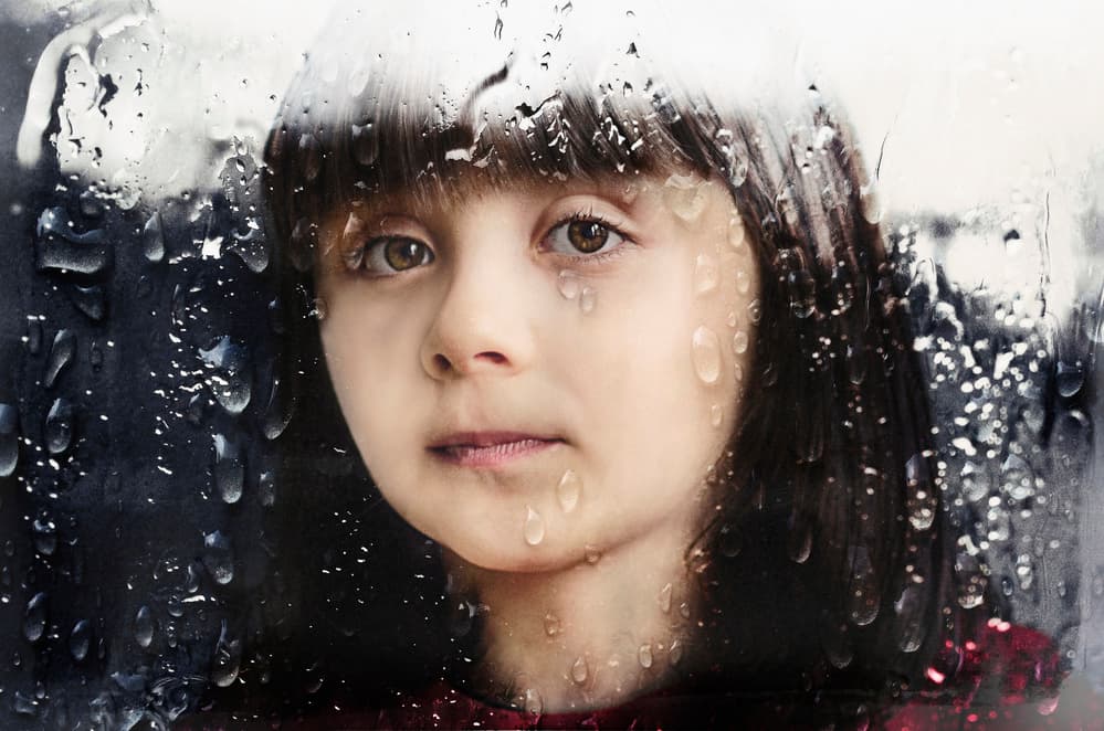 Girl Through Rainy Window by Desislava Ignatova — canvas wall art