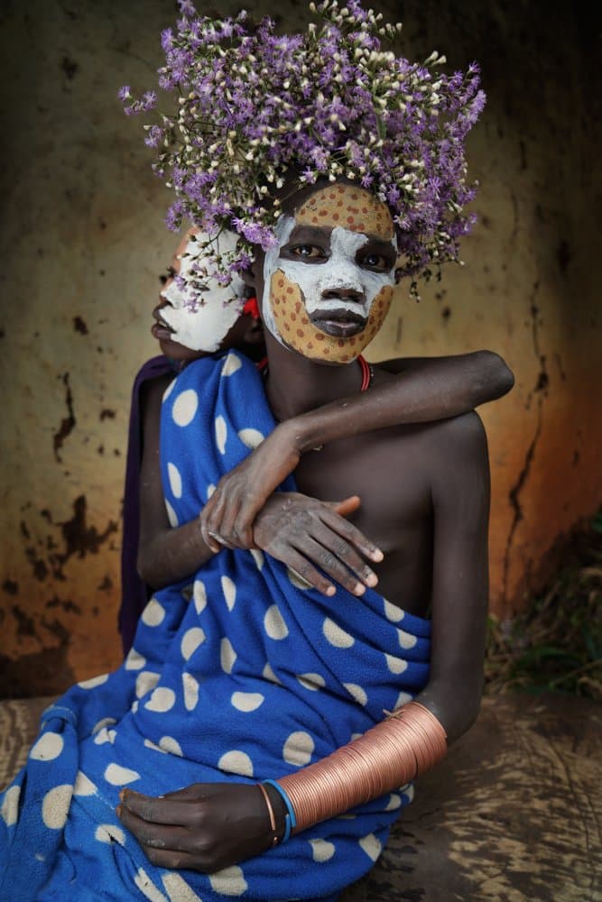 Painted Faces Floral Headdress by Sarawut Intarob — canvas wall art