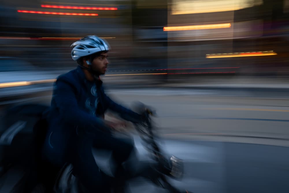 Urban Cyclist in Motion by Steven Zhou — canvas wall art