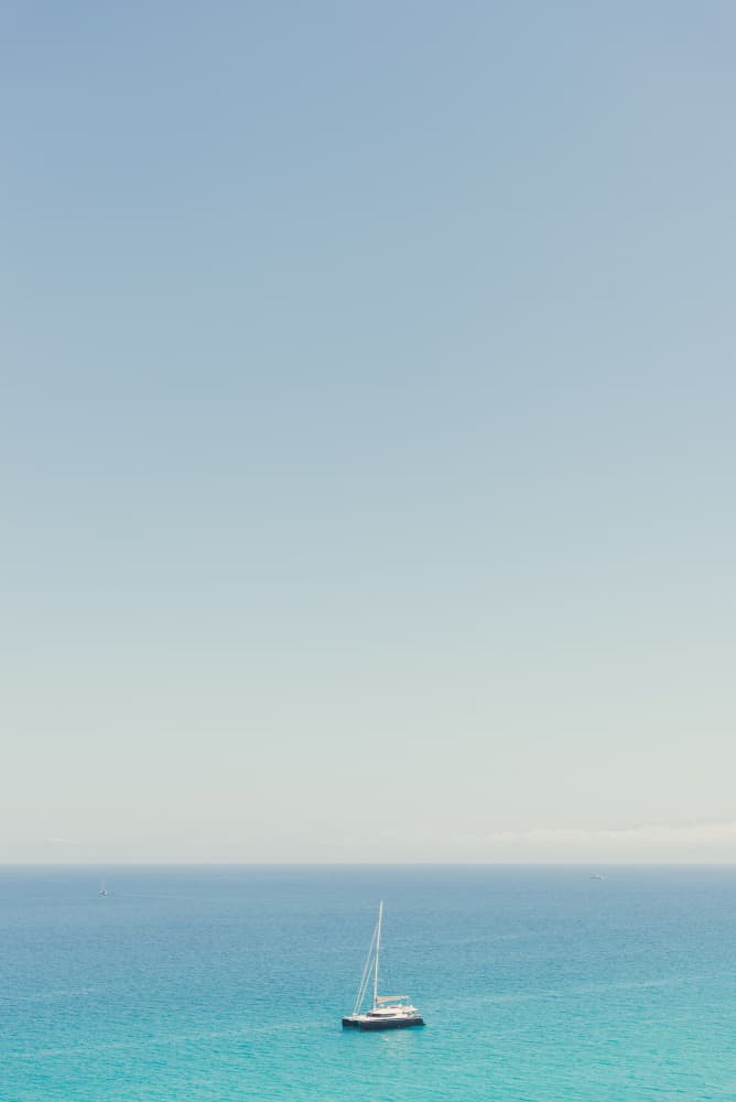 Sailboat on Blue Ocean by Photolovers — canvas wall art