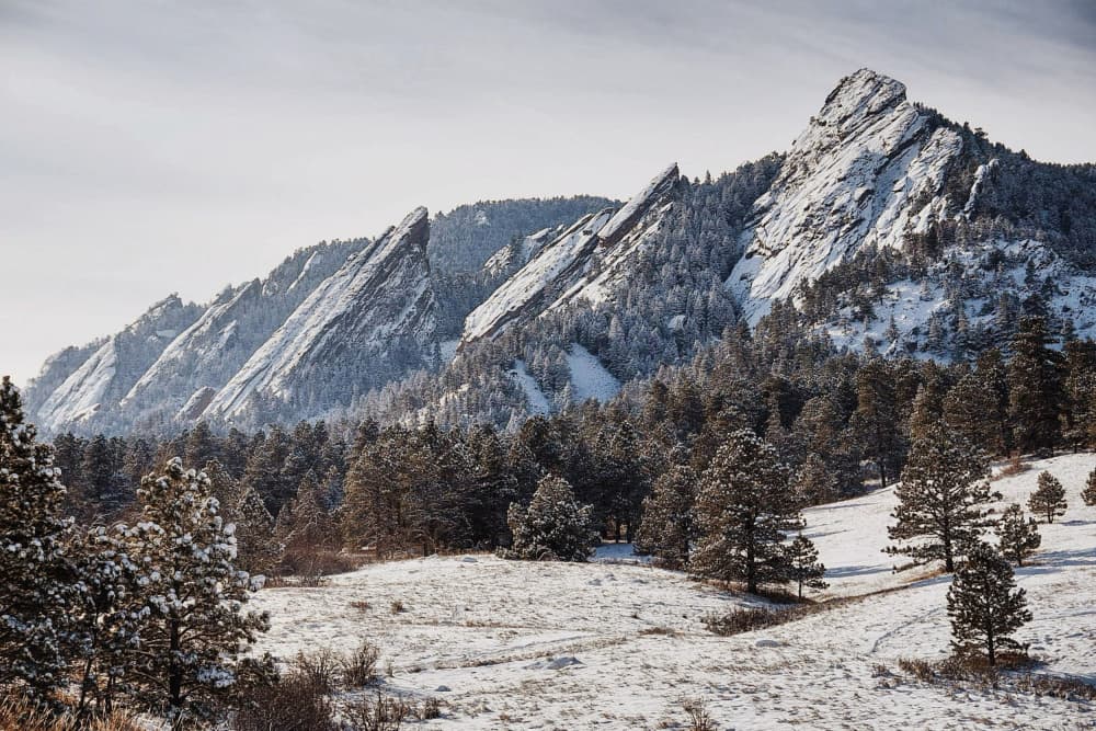 Snowy Flatirons Peaks by Del Mundo Imagery — canvas wall art