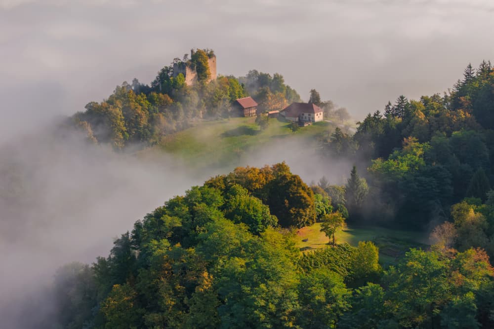 Misty Hilltop Castle by Jure Kravanja — canvas wall art