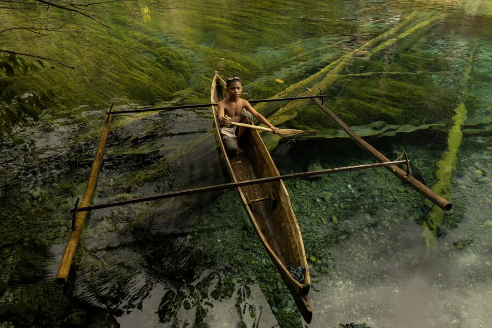 Boy in Green River by Sita Gramich — canvas wall art
