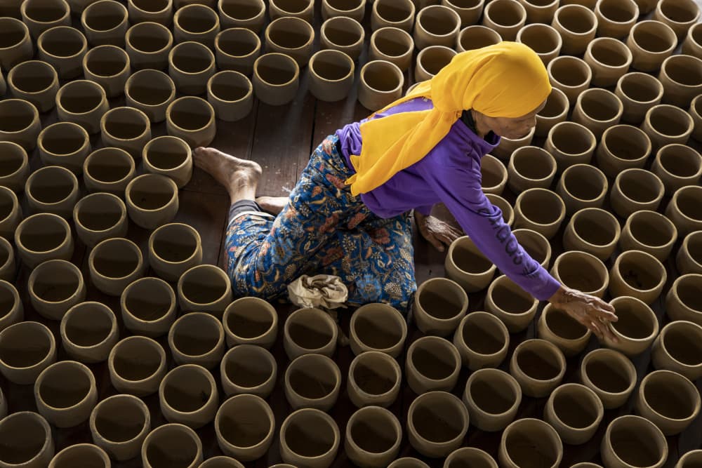 Artisan Making Clay Pots by Muljati Hidajat — canvas wall art
