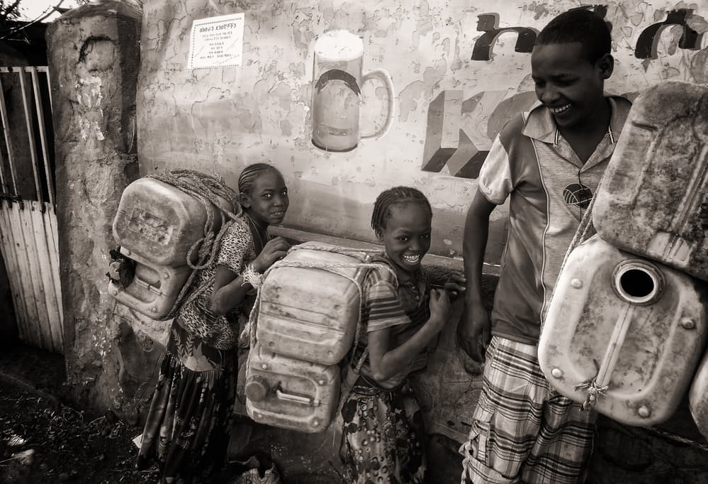 Joyful Water Carriers by Elena Molina — canvas wall art