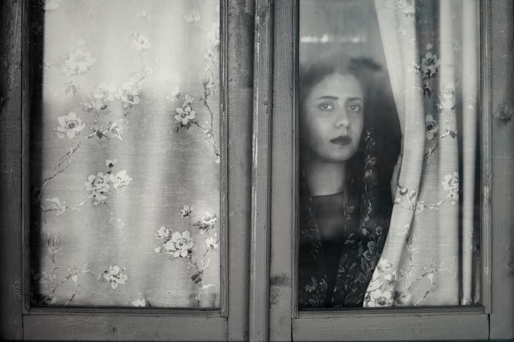 Pensive Woman at Window by Amir Heydari — canvas wall art