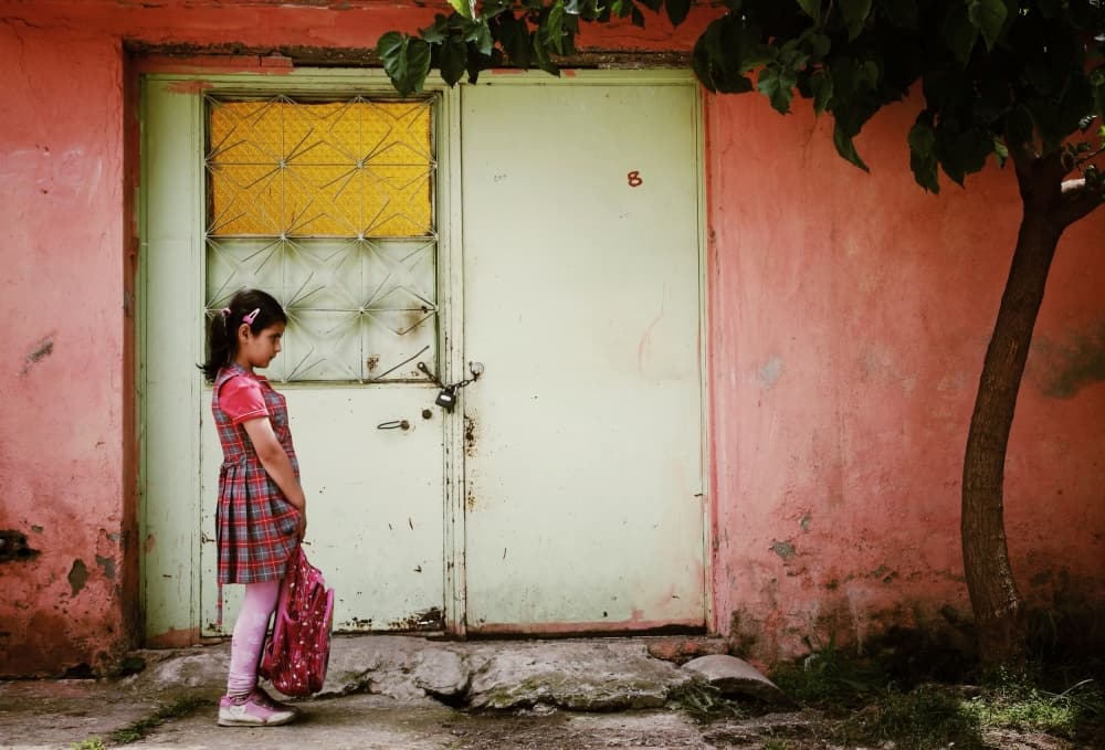 Schoolgirl Waiting Home by Ali Ayer — canvas wall art