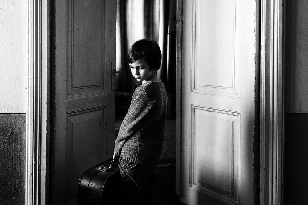 Pensive Boy Doorway by Marius Cinteza — canvas wall art