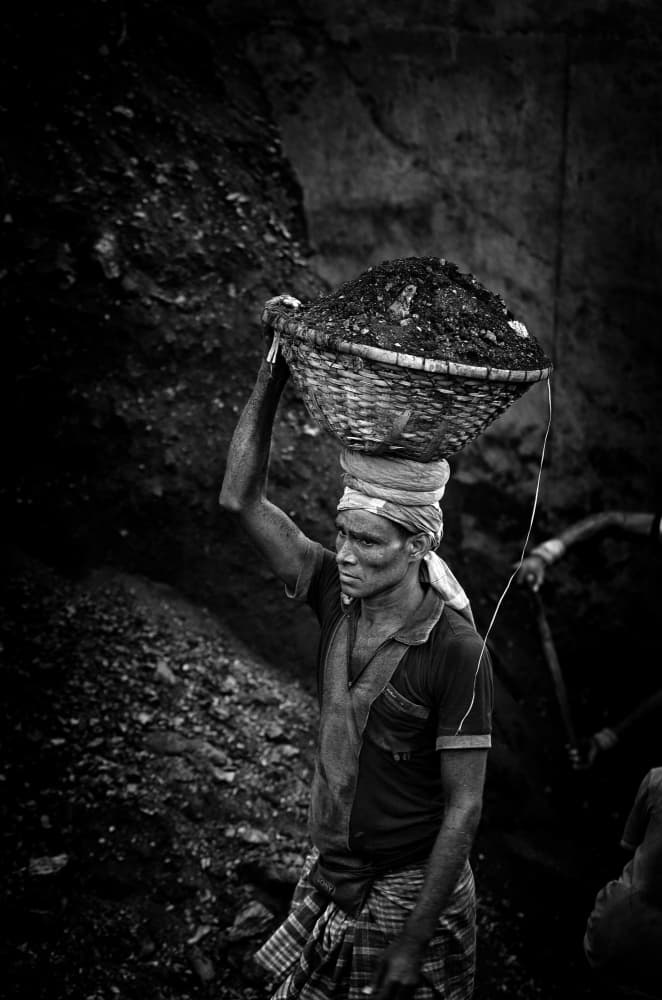 Man Carrying Coal by Garik — canvas wall art