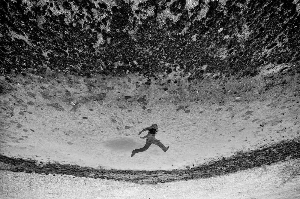 Running Reflection by Carlo Ferrara — canvas wall art