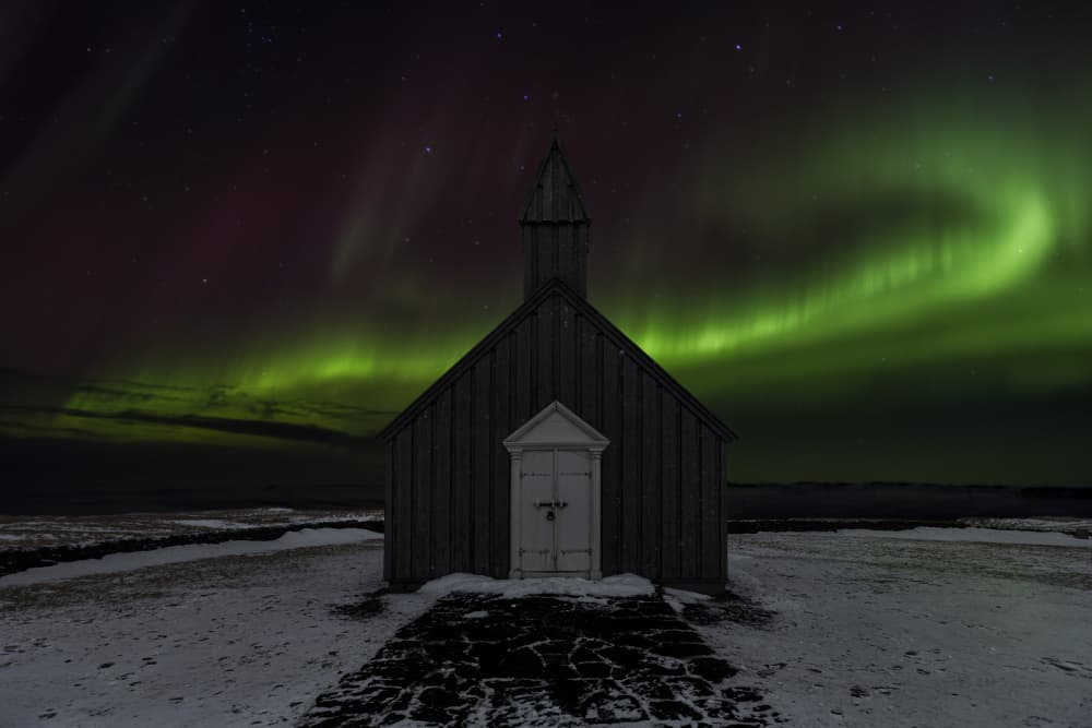 Aurora Over Snowy Church by Angéla Vicedomini — canvas wall art