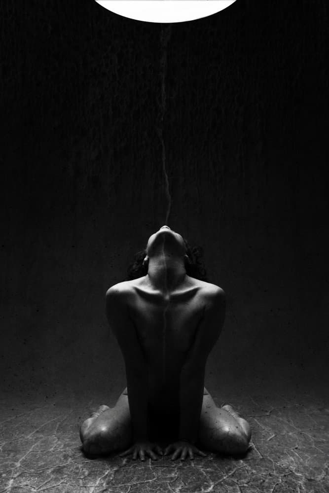 Kneeling Woman Under Stream by Laura Benvenuti — canvas wall art