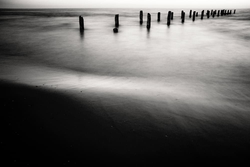 Calm Ocean Pilings by Tal Paz-Fridman — canvas wall art