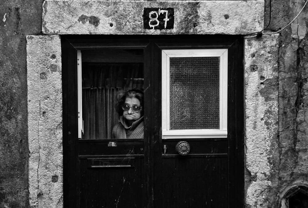 Observant Woman Doorway by Fernando Alves — canvas wall art