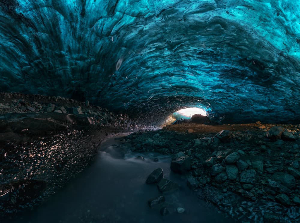 Blue Ice Cave Stream by Carlos Gonzalez — canvas wall art