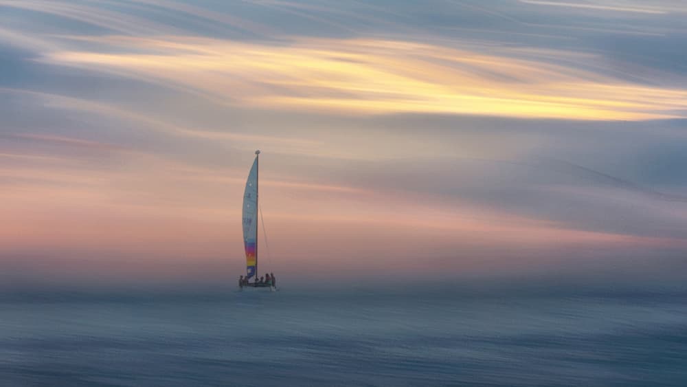 Dreamy Sailboat Sunset by Benjamine Hullot Scalvenzi — canvas wall art