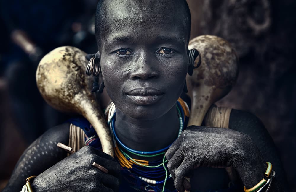 African Woman with Gourds by Joxe Inazio Kuesta Garmendia — canvas wall art