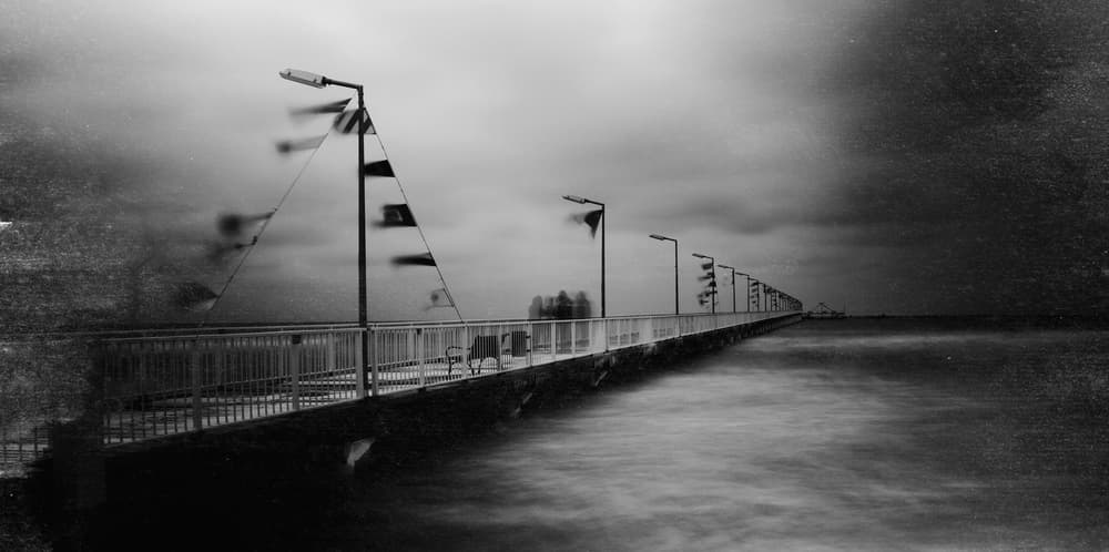 Moody Ocean Pier by Bogdan Bouşcă — canvas wall art