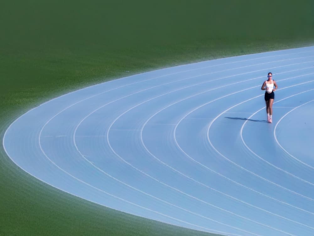 Athlete On Blue Track by Jasmine Zhang — canvas wall art