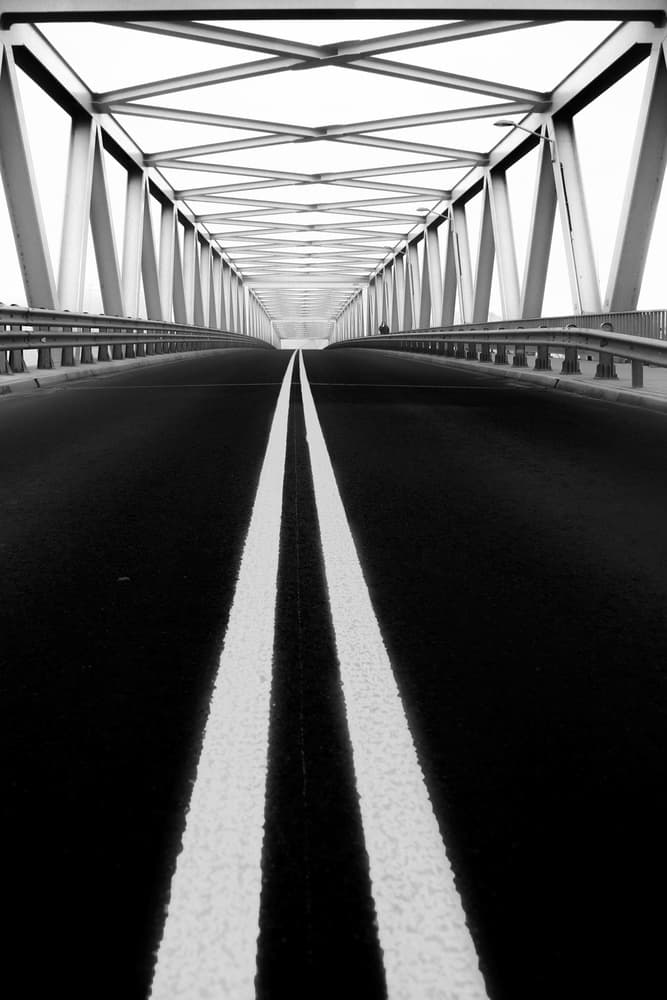 Monochrome Bridge Road by Anna Niemiec — canvas wall art