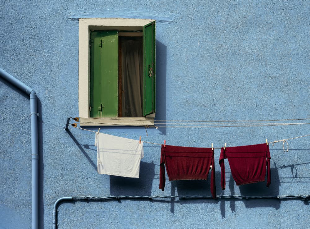 Blue Wall With Laundry by Tommaso Pessotto — canvas wall art