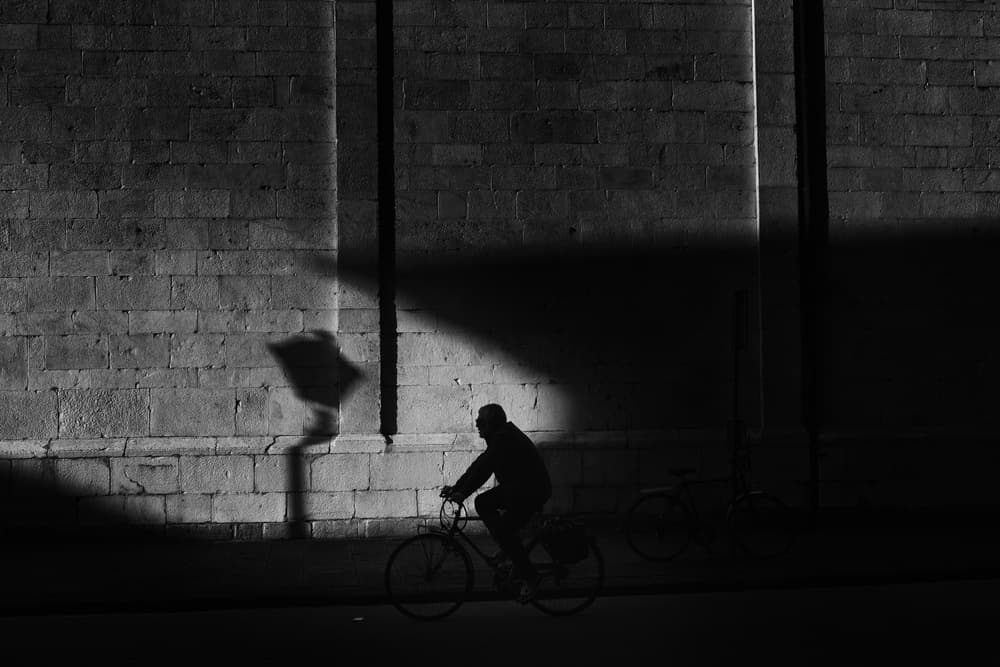 Street Cyclist Silhouette by Massimo Della Latta — canvas wall art