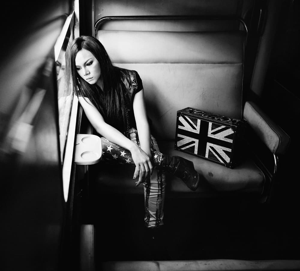 Pensive Woman on Train by Abr Abe — canvas wall art