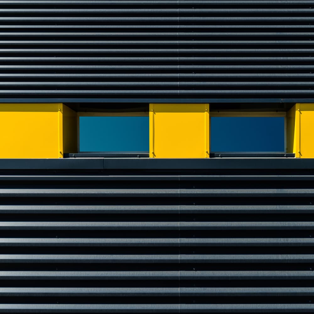 Bold Yellow Blue Facade by Luc Vangindertael (laGrange) — canvas wall art