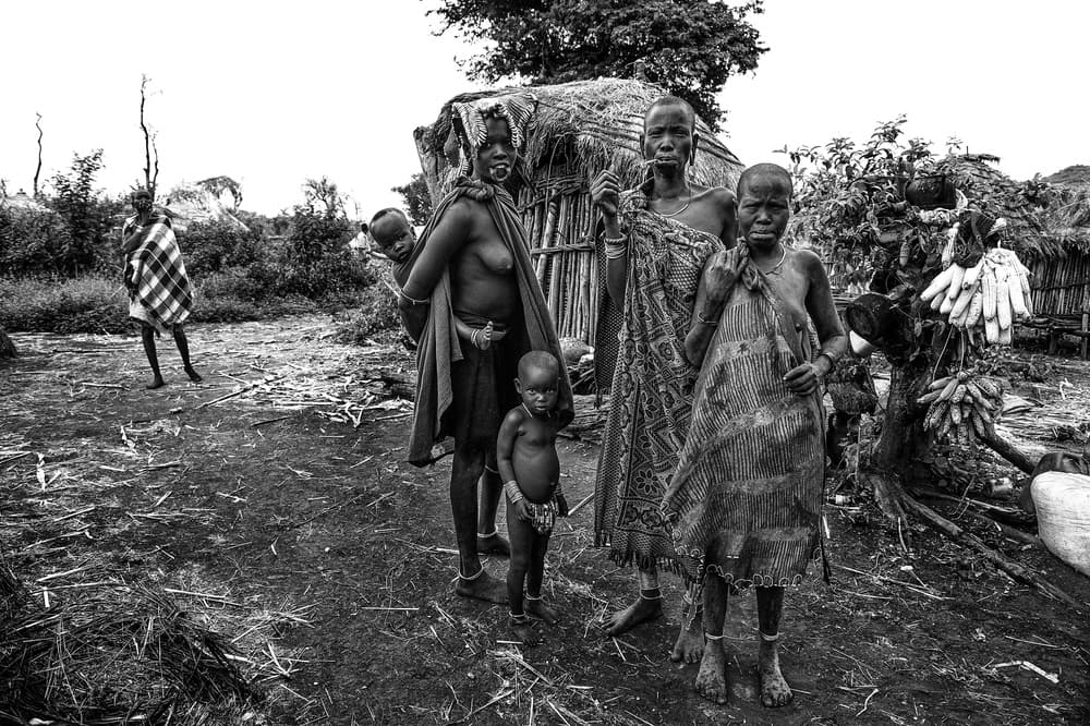 African Village Family by Joxe Inazio Kuesta Garmendia — canvas wall art