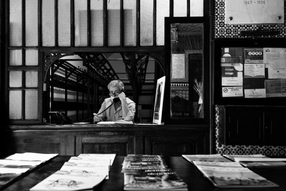 Woman at Reception Desk by Carlos Costa — canvas wall art
